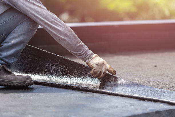 Professional Basement Waterproofing technician working in Lansing, KS